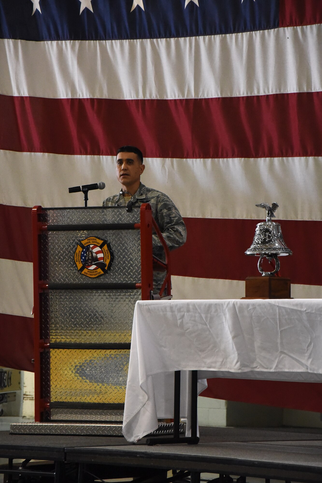 U.S. Air Force Col. Ricky Mills, 17th Training Wing commander, speaks at the 9/11 Memorial at the Louis F. Garland Department of Defense Fire Academy high bay on Goodfellow Air Force Base, Texas, Sept. 11, 2017. Mills spoke about how America is still healing after the events of 9/11. (U.S. Air Force photo by Airman Zachary Chapman/Released)