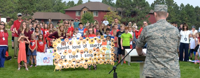 Students from Southwest Middle School and Corral Drive Elementary listen to a speech from Col. David J. Linkh, the 28th Medical Group commander, in Rapid City, S.D., Sept. 11, 2017. Multiple guest speakers came visited schools in Rapid City and Box Elder to speak about the heroism of first responders on 9/11 and educate students.  (U.S. Air Force Photo by Airman 1st Class Thomas Karol)