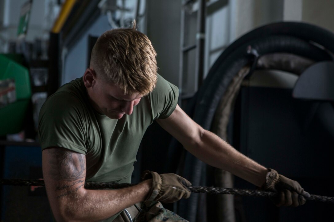 A U.S. Marine with Battalion Landing Team 2nd Battalion, 6th Marine Regiment, 26th Marine Expeditionary Unit (MEU), assists in the process of conducting a proper replenishment-at-sea (RAS) aboard the amphibious assault ship USS Kearsarge (LHD 3), Caribbean Sea, Sep. 11, 2017. The 26th MEU is supporting the lead federal agency in providing humanitarian relief (and/or search and rescue) efforts for Hurricane Irma. (U.S. Marine Corps photo by Lance Cpl. Santino D. Martinez)