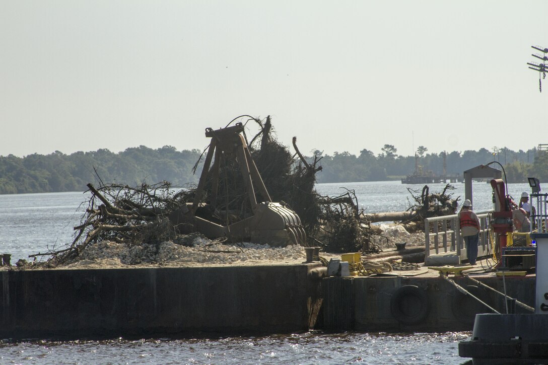 Port of Beaumont crews removed large trees that were brought in by flood waters and deposited in the navigation channel from Hurricane Harvey.