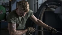 A U.S. Marine with Battalion Landing Team 2nd Battalion, 6th Marine Regiment, 26th Marine Expeditionary Unit, assists other Marines and Sailors during a replenishment-at-sea aboard the amphibious assault ship USS Kearsarge, Caribbean Sea, Sep. 13, 2017.