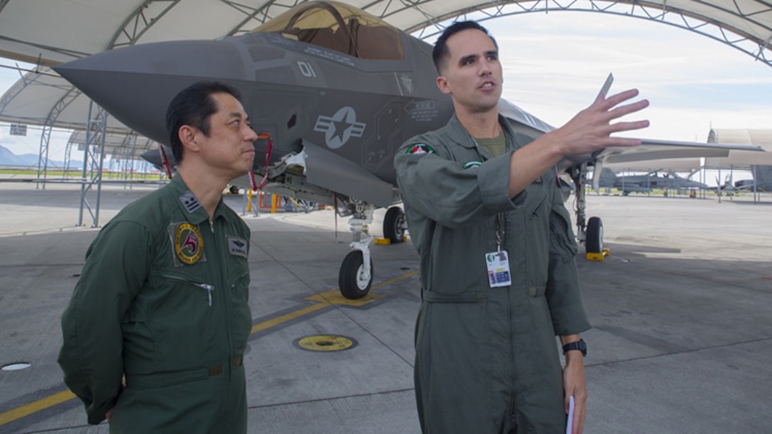 U.S. Marine Corps Maj. Adam Wellington, right, aircraft maintenance officer for Marine Fighter Attack Squadron 121, answers questions for Japan Air Self-Defense Force Lt. Col. Mamoru Yamaura, F-35A Lightning II program office chief with Third Air Wing, during an educational tour and class centered on the F-35B Lightning II at Marine Corps Air Station Iwakuni, Japan, Sept. 13, 2017. Several classes were conducted for JASDF personnel regarding maintenance, serviceability, operability and more. Afterwards, they briefly toured VMFA-121’s facility, taking a peek into a few shop departments and visiting the hangar to see, touch and study the aircraft up close. This is the first time VMFA-121 has conducted an exchange like this.