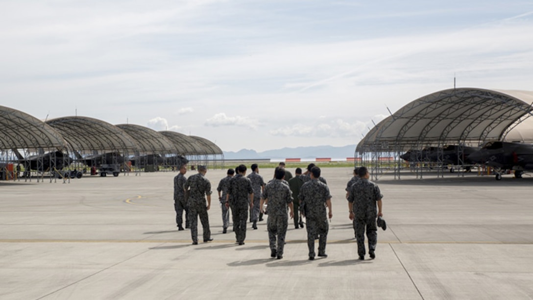 U.S. Marines with Marine Fighter Attack Squadron 121 lead a group of Japan Air Self-Defense Force personnel during an educational tour and class centered on the F-35B Lightning II at Marine Corps Air Station Iwakuni, Japan, Sept. 13, 2017.