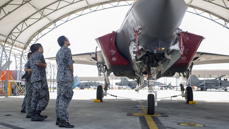 Japan Air Self-Defense Force personnel study the F-35B Lightning II during an educational tour and class led by Marine Fighter Attack Squadron 121 at Marine Corps Air Station Iwakuni, Japan, Sept. 13, 2017.