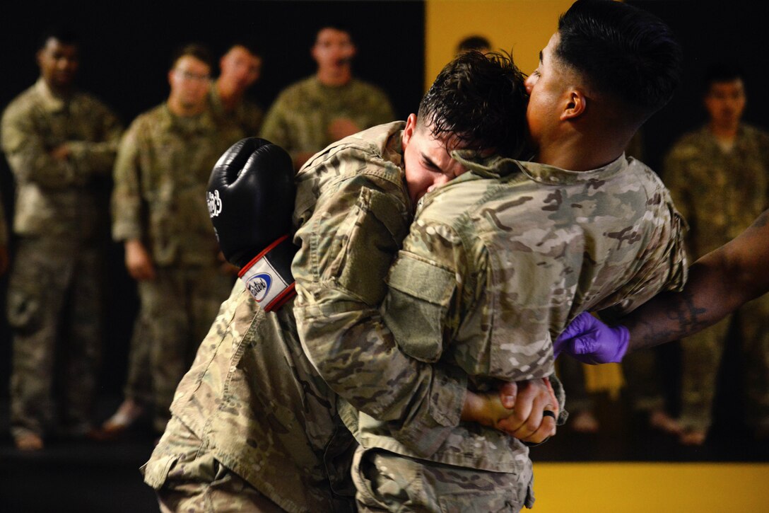Soldiers conduct punching drills during a basic combatives course