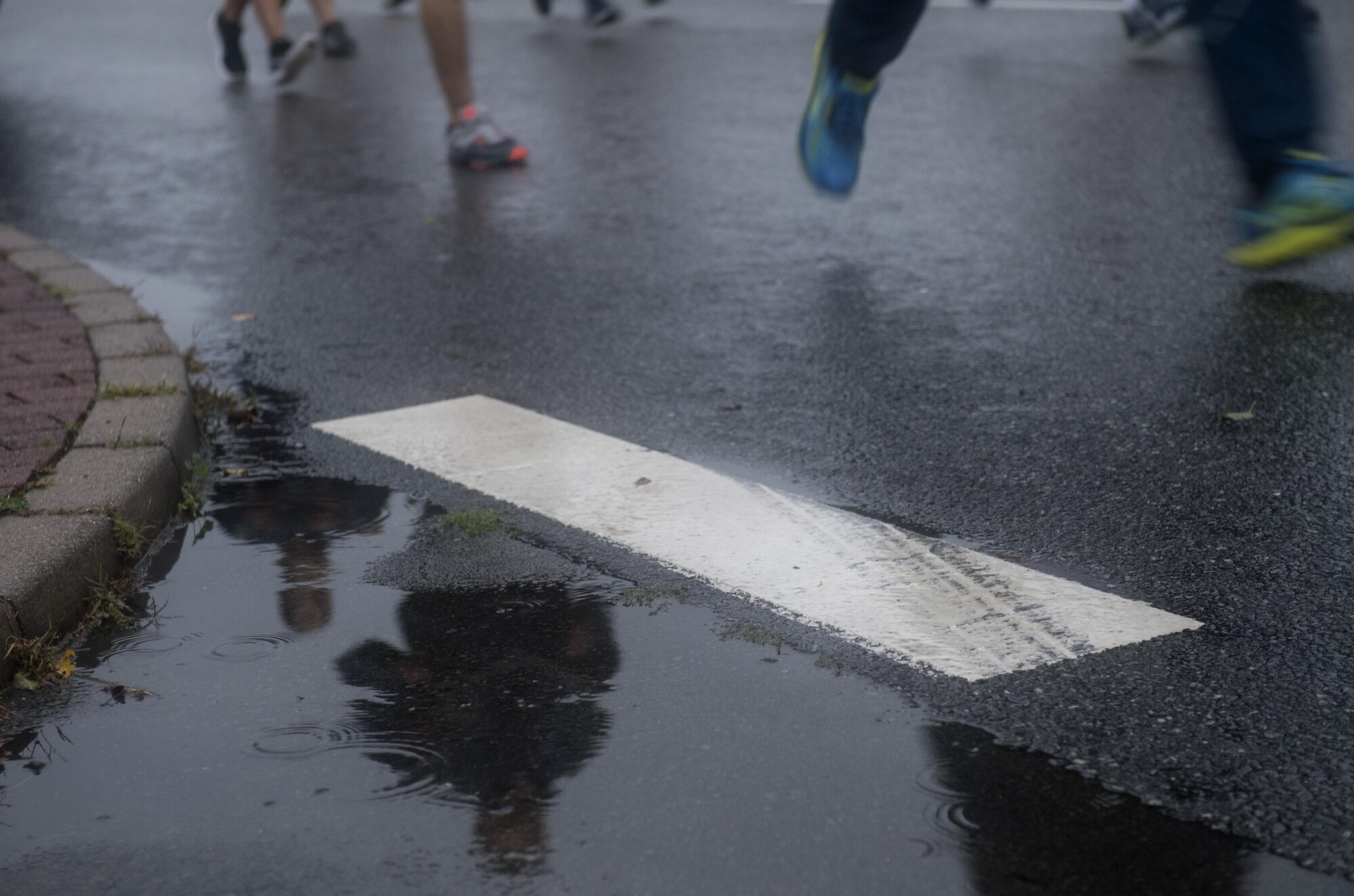 U.S. Airmen assigned to the 86th Airlift Wing, 521st Air Mobility Wing, and 435th Air Ground Operations Wing, participate in the Tri-Wing POW/MIA Memorial Run on Ramstein Air Base, Germany, Sept. 13, 2017. Approximately 1,200 Airmen from the three wings participated in the run. (U.S. Air Force photo by Senior Airman Tryphena Mayhugh)