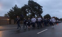 U.S. Airmen assigned to 786th Force Support Squadron run in formation during the Tri-Wing POW/MIA Memorial Run on Ramstein Air Base, Germany, Sept. 13, 2017. The run was approximately three miles and was held in honor of service members who were or are prisoners of war or missing in action. (U.S. Air Force photo by Senior Airman Tryphena Mayhugh)