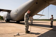 U.S. Air Force Reserve members from the 913th Maintenance Squadron unchain a C-130J Super Hercules and prepare it to support hurricane relief missions Sept. 9, 2017, at Little Rock Air Force Base, Ark. Hurricanes Harvey and Irma have devastated portions of the Gulf Coast and aircraft and personnel from Little Rock AFB have joined military units across the country in providing support. (U.S. Air Force photo by Master Sgt. Jeff Walston)