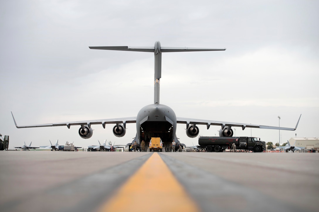 Airmen load a generator onto a C-17 Globemaster III