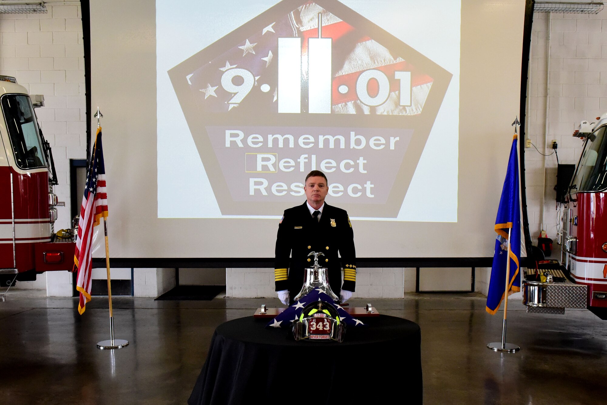 Sean Quinby, 4th Civil Engineer Squadron fire chief, rings a bell in honor of the fallen fire fighters during a 9/11 Remembrance Ceremony, Sept. 11, 2017, at Seymour Johnson Air Force Base, North Carolina. On Sept. 11, 2001, a total of 19 terrorists hijacked four commercial passenger jet airliners and took the lives of thousands of men, women, and children. (U.S. Air Force photo by Airman 1st Class Victoria Boyton)