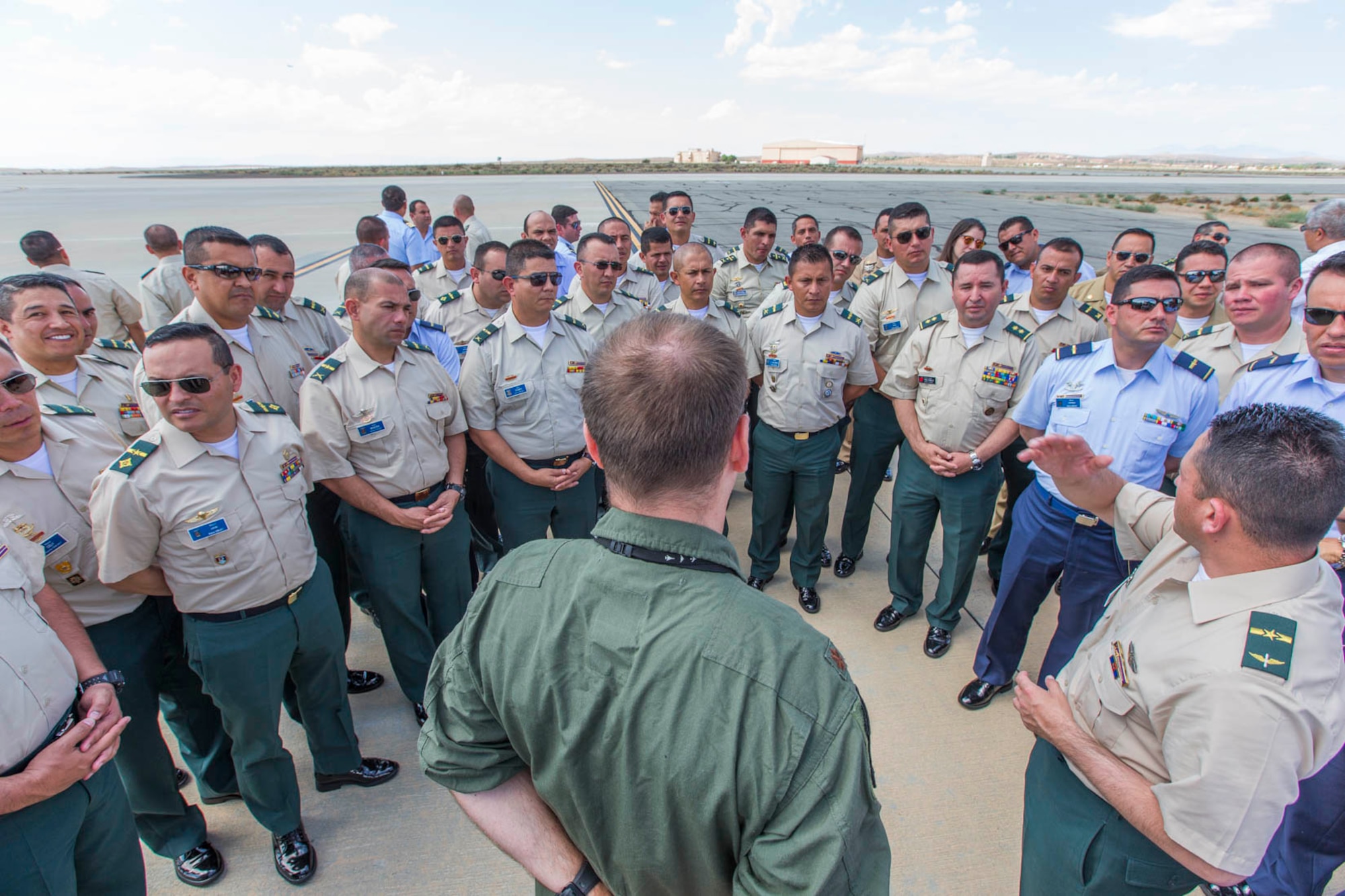 Members of the Republic of Colombia's military pose for a photo in front of a B-1B Lancer as part of their visit to Edwards Sept. 12. (U.S. Air Force photo by Christopher Okula)