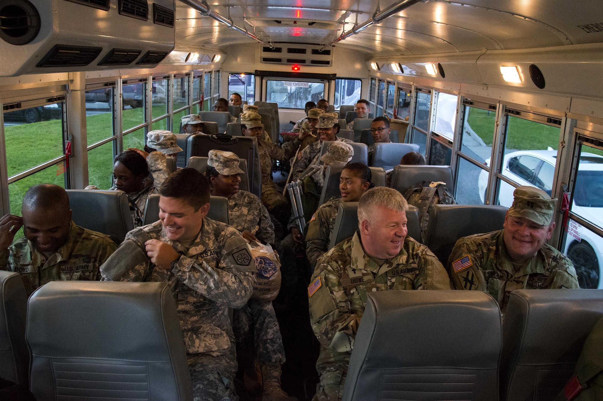 Georgia Army National Guardsmen await departure on a bus, Sept. 13, 2017, at Moody Air Force Base, Ga. Units from the 48th Infantry Brigade Combat Team and Joint Task Force 781st Chemical, Radiological, Nuclear, Explosive Response Package stayed the night at Moody before heading to Orlando, Fla., to provide humanitarian relief for the victims of Hurricane Irma. (U.S. Air Force photo by Airman 1st Class Erick Requadt)