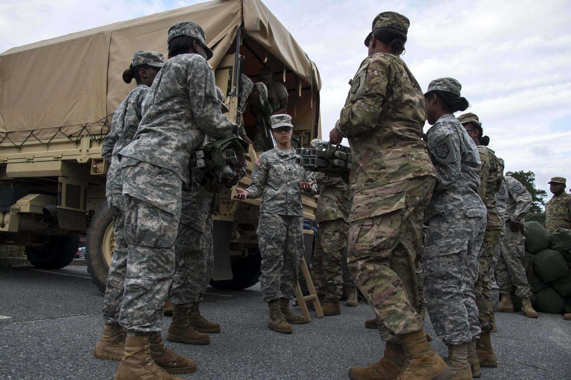 Georgia Army National Guardsmen from the 348th Brigade Support Battalion load up their gear, Sept. 13, 2017, at Moody Air Force Base, Ga. Units from the 48th Infantry Brigade Combat Team and Joint Task Force 781st Chemical, Radiological, Nuclear, Explosive Response Package stayed the night at Moody before heading to Orlando, Fla., to provide humanitarian relief for the victims of Hurricane Irma. (U.S. Air Force photo by Airman 1st Class Erick Requadt)