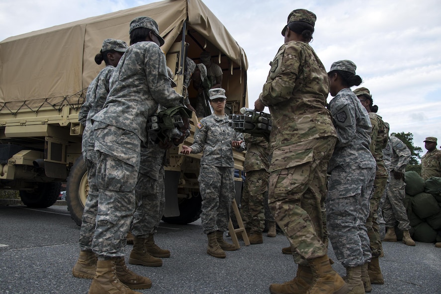 Georgia Army National Guardsmen from the 348th Brigade Support Battalion load up their gear, Sept. 13, 2017, at Moody Air Force Base, Ga. Units from the 48th Infantry Brigade Combat Team and Joint Task Force 781st Chemical, Radiological, Nuclear, Explosive Response Package stayed the night at Moody before heading to Orlando, Fla., to provide humanitarian relief for the victims of Hurricane Irma. (U.S. Air Force photo by Airman 1st Class Erick Requadt)