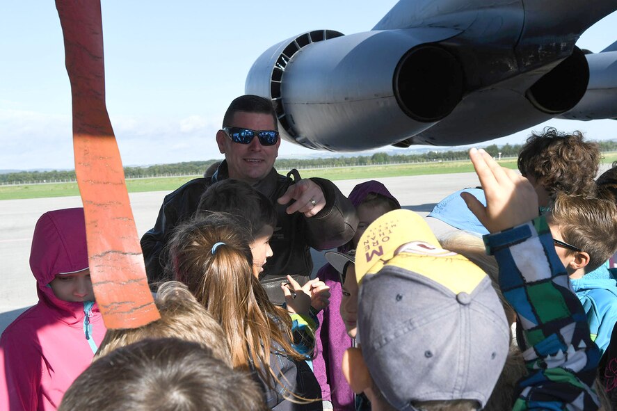 U.S. Air Force Lt. Col. Shawn Werchan, the 307th Operations Support Squadron commander, calls on a young student to answer a trivia question about the B-52 Stratofortress during a school tour at the Leoš Janáček Ostrava Airport, Czech Republic, Sept. 13, 2017.