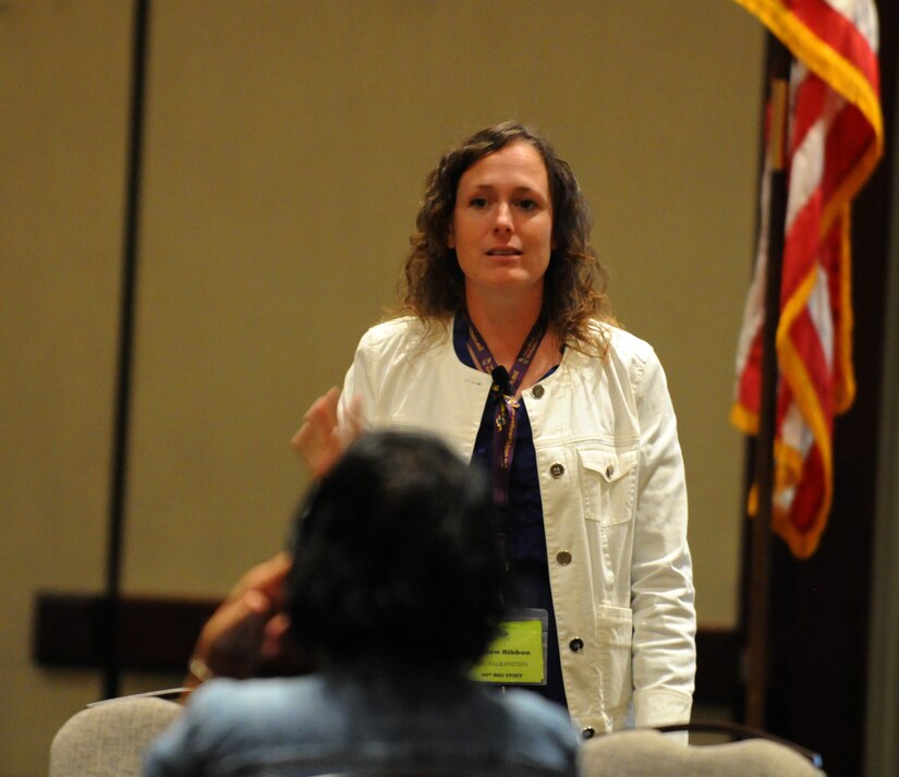 Sergeant 1st Class Jolaina Falkenstein, a human resources NCO with the 88th Regional Support Command, addresses the post-deployment group during a presentation at the Yellow Ribbon event in Minneapolis September 9.