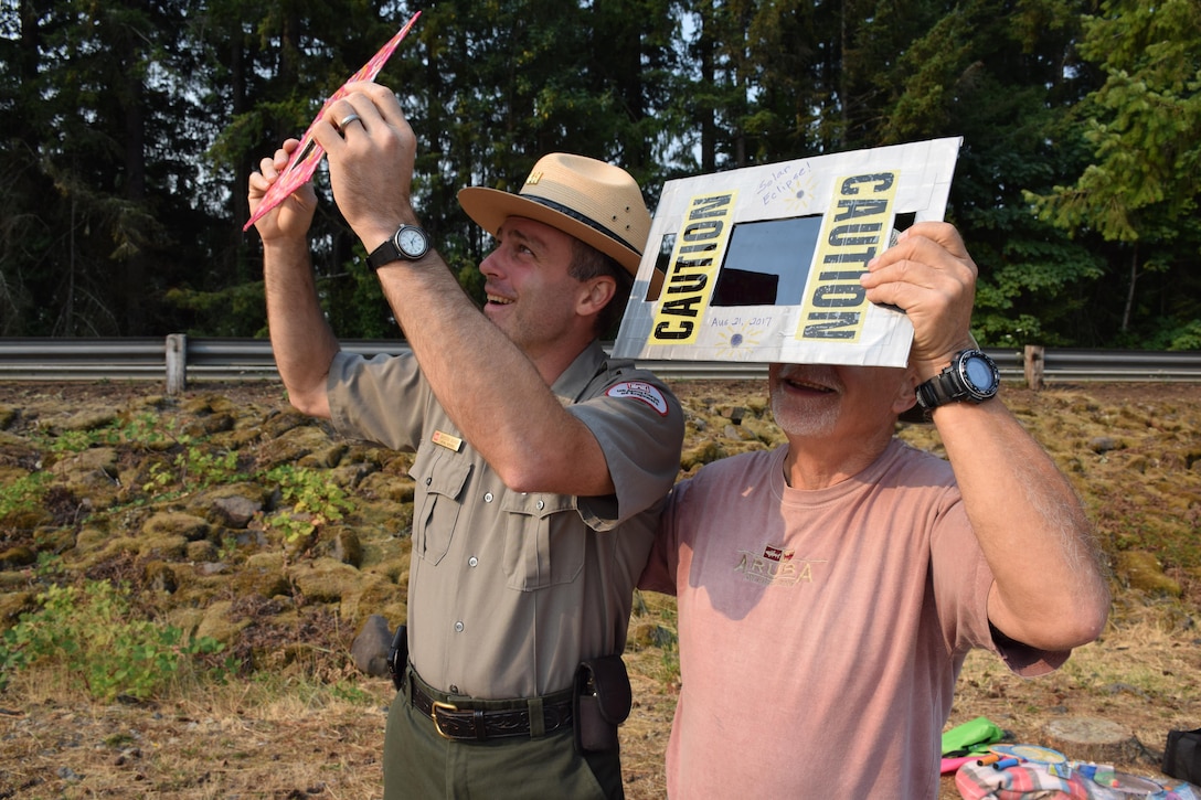 Members of the public gather at Foster Reservoir for the total solar eclipse, Aug. 21, 2017. Foster Dam and Reservoir was in the path of totality for the eclipse. Cam Bishop, Willamette Valley Natural Resource Specialist, interacts with the public during the eclipse.
