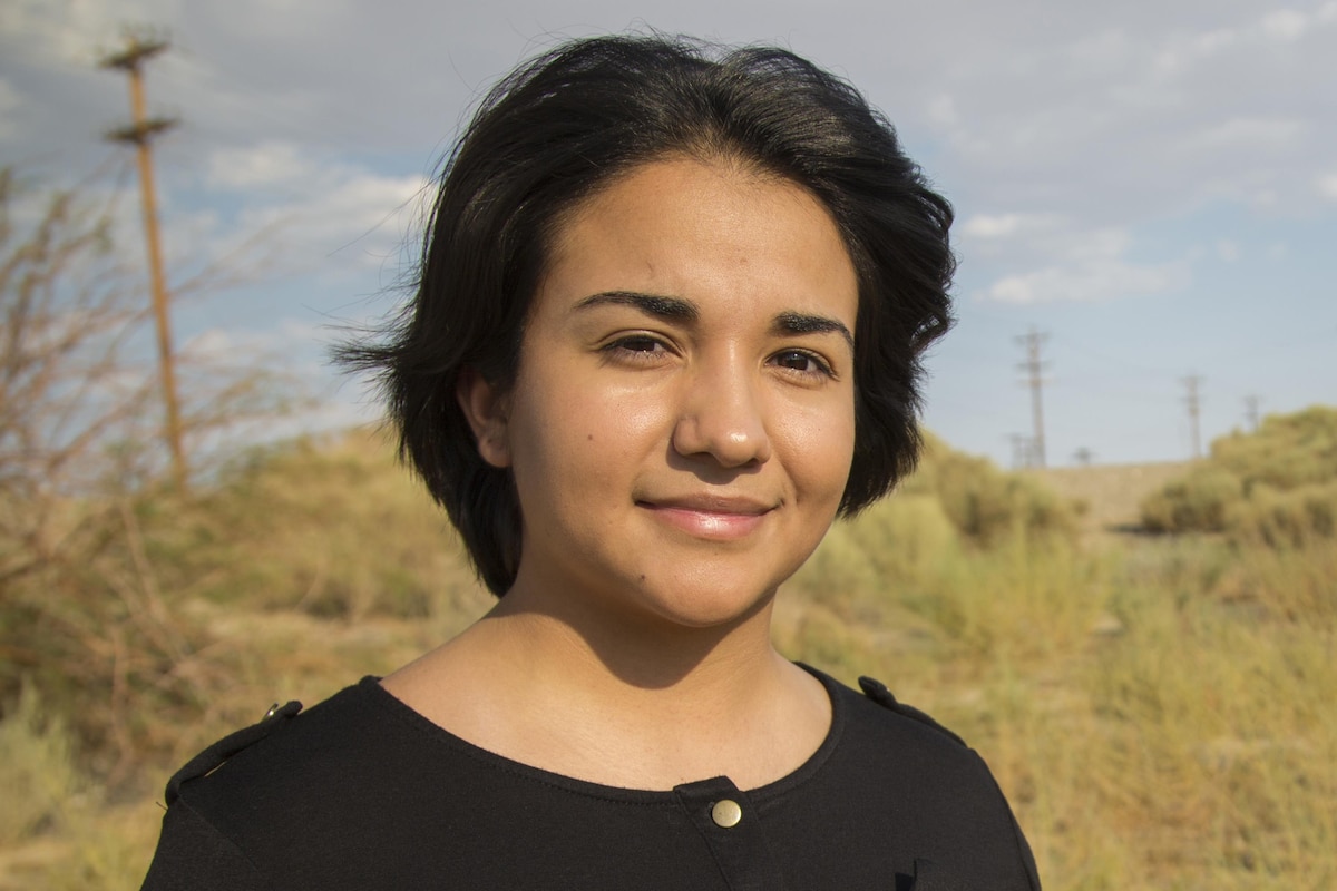 A woman poses for the camera.