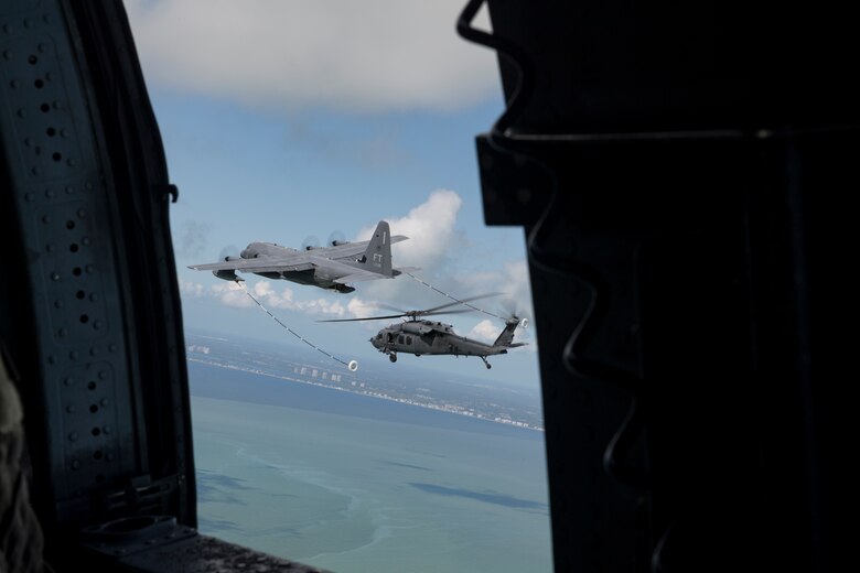 An HH-60G Pave Hawk assigned to the 66th Rescue Squadron prepares for a helicopter air-to-air refueling with an HC-130J Combat King II from the 79th Rescue Squadron, Sept. 12, 2017, over the skies of Florida. The 563d Rescue Group prepositioned aircraft and personnel for rescue operations in support of FEMA and U.S. Northern Command after Hurricane Irma made landfall in Florida. (U.S. Air Force photo by Tech. Sgt. Zachary Wolf)