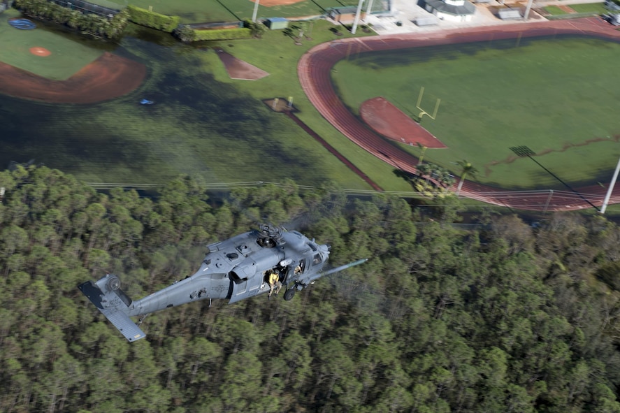 An HH-60G Pave Hawk assigned to the 66th Rescue Squadron searches for anyone needing to be rescued, Sept. 12, 2017, over the skies of Florida. The 563d Rescue Group prepositioned aircraft and personnel for rescue operations in support of FEMA and U.S. Northern Command after Hurricane Irma made landfall in Florida. (U.S. Air Force photo by Tech. Sgt. Zachary Wolf)