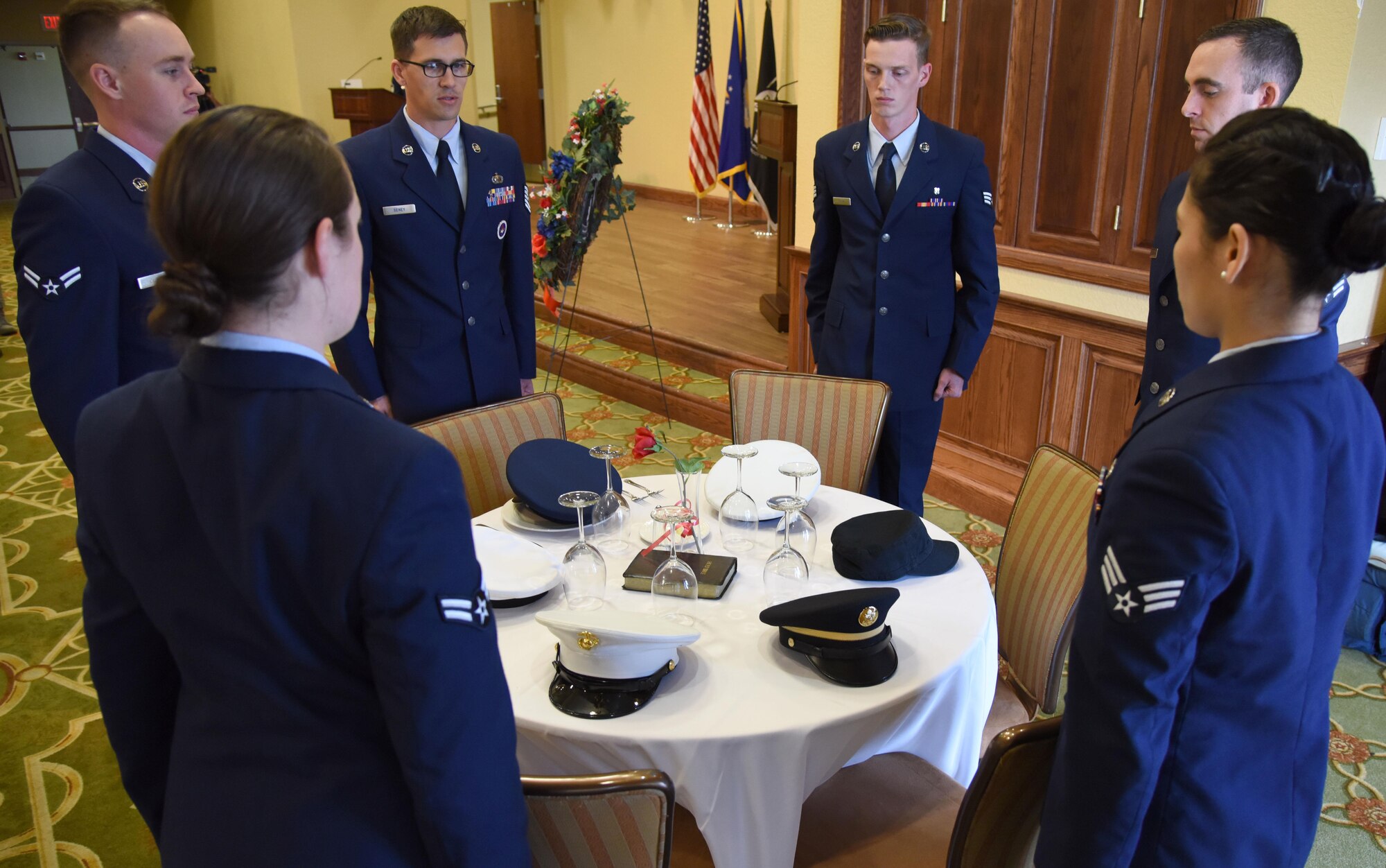 Members of the Air Force Sergeants Association conduct a POW/MIA table ceremony during a POW/MIA Remembrance Luncheon at the Bay Breeze Event Center Sept. 13, 2017, on Keesler Air Force Base, Mississippi. The event, hosted by the AFSA, was held to raise awareness and pay tribute to all prisoners of war and military members still missing in action. (U.S. Air Force photo by Kemberly Groue)