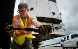 Staff Sgt. Donny Johnson, 43rd Air Mobility Squadron, Pope Air Force Base, N.C., helps disconnect a trailer from a truck transporting goods and commodities in support of Hurricane Irma relief efforts at Joint Base Charleston’s North Auxiliary Airfield, S.C., Sept. 13, 2017. The airfield acts as a receiving and distribution staging area for goods and commodities being transported to hurricane victims here and areas to the southeast over the next few weeks. Airmen of the 43rd Air Mobility Operations Group and the U.S. Department of Homeland Security - Federal Emergency Management Agency (FEMA) are working side-by-side executing relief efforts. (U.S. Air Force photo by Staff Sgt. Christopher Hubenthal)
