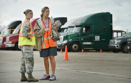 First Lt. Savannah Emmrich, left, 43rd Air Base Squadron fuels management officer in charge, Pope Army Airfield, N.C., speaks with Sonia Hancock, right, U.S. Department of Homeland Security - Federal Emergency Management Agency (FEMA) logistics specialist, at Joint Base Charleston’s North Auxiliary Airfield, S.C., Sept. 13, 2017. The airfield acts as a receiving and distribution staging area for goods and commodities being transported to hurricane victims here and areas to the southeast over the next few weeks. Airmen of the 43rd Air Mobility Operations Group and FEMA are working side-by-side executing relief efforts. (U.S. Air Force photo by Staff Sgt. Christopher Hubenthal)