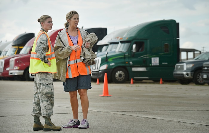 First Lt. Savannah Emmrich, left, 43rd Air Base Squadron fuels management officer in charge, Pope Army Airfield, N.C., speaks with Sonia Hancock, right, U.S. Department of Homeland Security - Federal Emergency Management Agency (FEMA) logistics specialist, at Joint Base Charleston’s North Auxiliary Airfield, S.C., Sept. 13, 2017. The airfield acts as a receiving and distribution staging area for goods and commodities being transported to hurricane victims here and areas to the southeast over the next few weeks. Airmen of the 43rd Air Mobility Operations Group and FEMA are working side-by-side executing relief efforts. (U.S. Air Force photo by Staff Sgt. Christopher Hubenthal)