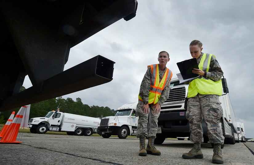 First Lt. Savannah Emmrich, left, 43rd Air Base Squadron fuels management officer in charge, and Senior Airman Haley Bradshaw, right, 43rd ABS personnelist, both assigned to Pope Army Airfield, N.C., log information for a truck carrying goods prepped to support Hurricane Irma relief efforts at Joint Base Charleston’s North Auxiliary Airfield, S.C., Sept. 13, 2017. The airfield acts as a receiving and distribution staging area for goods and commodities being transported to hurricane victims here and areas to the southeast over the next few weeks. Airmen of the 43rd Air Mobility Operations Group and U.S. Department of Homeland Security - Federal Emergency Management Agency (FEMA), are working side-by-side executing relief efforts. (U.S. Air Force photo by Staff Sgt. Christopher Hubenthal)