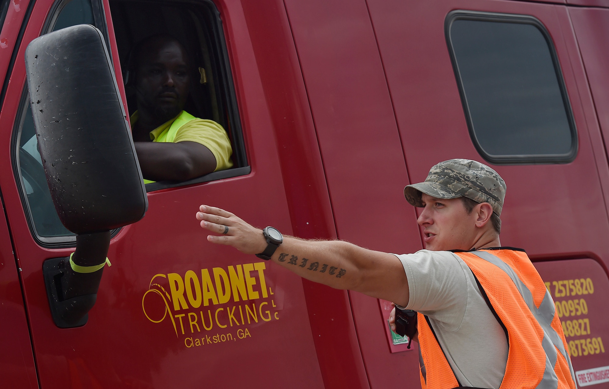 Staff Sgt. Micah Hallman, 43rd Air Mobility Squadron air transportation specialist, Pope Army Airfield, N.C., directs a truck driver transporting goods prepped to support Hurricane Irma relief efforts at Joint Base Charleston’s North Auxiliary Airfield, S.C., Sept. 13, 2017. The airfield acts as a receiving and distribution staging area for goods and commodities being transported to hurricane victims here and areas to the southeast over the next few weeks. Airmen of the 43rd Air Mobility Operations Group and U.S. Department of Homeland Security - Federal Emergency Management Agency (FEMA), are working side-by-side executing relief efforts. (U.S. Air Force photo by Staff Sgt. Christopher Hubenthal)