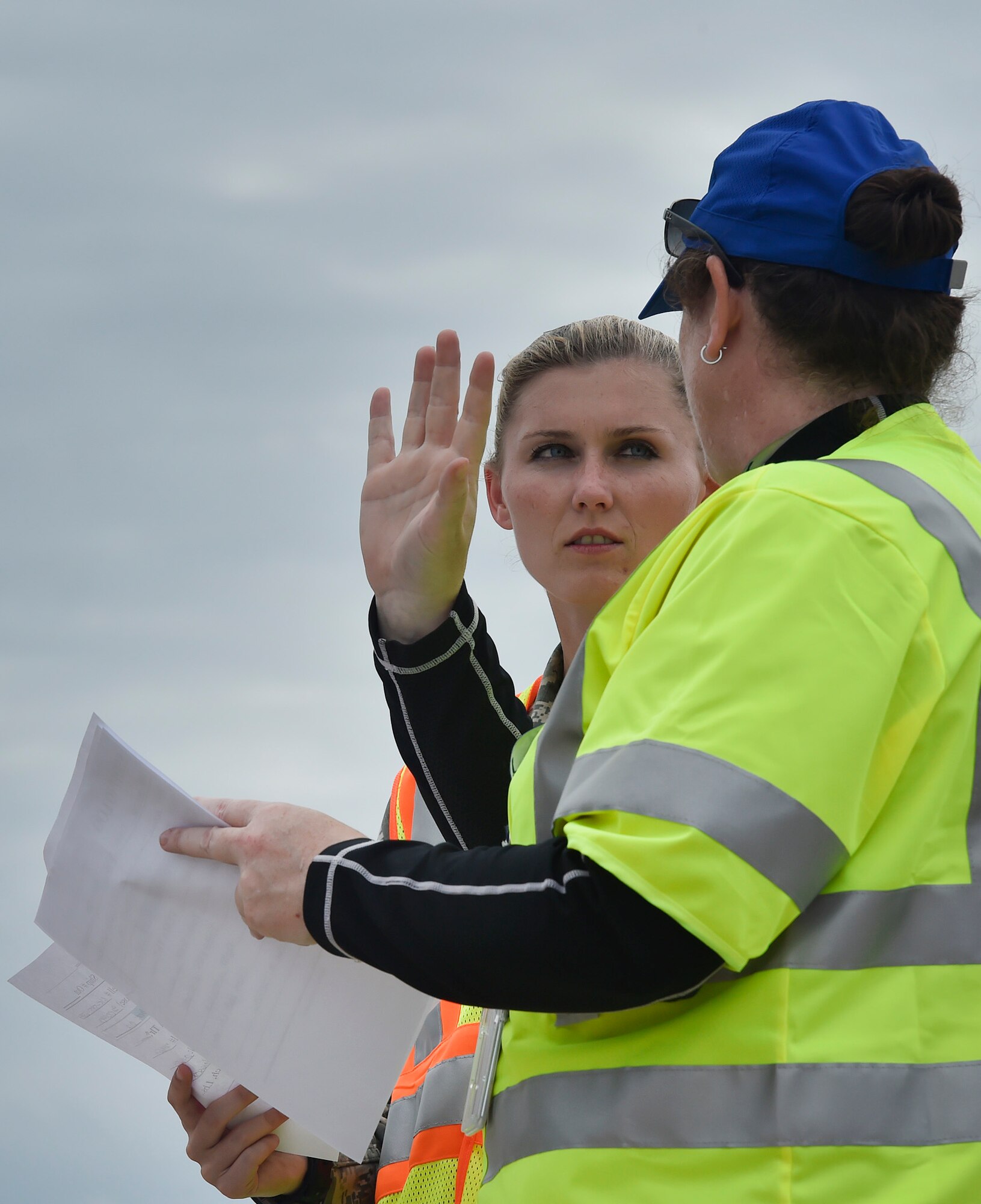 First Lt. Savannah Emmrich, 43rd Air Base Squadron fuels management officer in charge, Pope Army Airfield, N.C., speaks with Alice LaMere, U.S. Department of Homeland Security surge capacity force, at Joint Base Charleston’s North Auxiliary Airfield, S.C., Sept. 13, 2017. The airfield acts as a receiving and distribution staging area for goods and commodities being transported to hurricane victims here and areas to the southeast over the next few weeks. Airmen of the 43rd Air Mobility Operations Group and U.S. Department of Homeland Security - Federal Emergency Management Agency (FEMA), are working side-by-side executing relief efforts. (U.S. Air Force photo by Staff Sgt. Christopher Hubenthal)