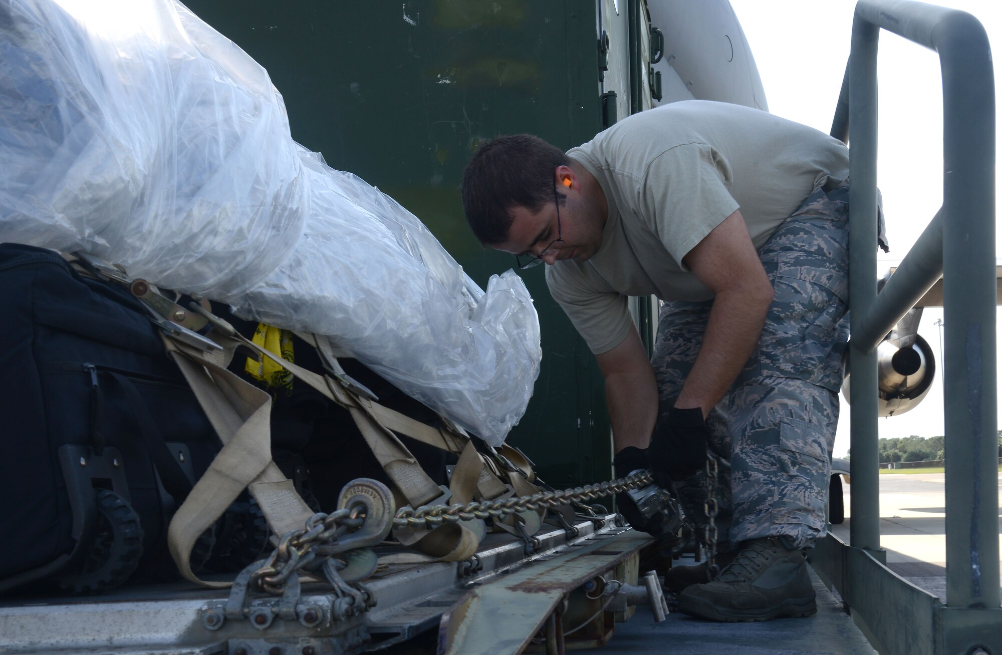 A U.S. Air Force Airman assigned to the 6th Logistics Readiness Squadron, secures cargo at MacDill Air Force Base, Fla., Sept. 12, 2017.