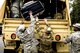 Georgia Army National Guardsmen from the 348th Brigade Support Battalion load up their gear, Sept. 13, 2017, at Moody Air Force Base, Ga. Units from the 48th Infantry Brigade Combat Team and Joint Task Force 781st Chemical, Radiological, Nuclear, and Explosives response packages, stayed the night at Moody AFB before heading to Orlando, Fla. to provide humanitarian relief for the victims of Hurricane Irma. (U.S. Air Force Photo by Airman Eugene Oliver)