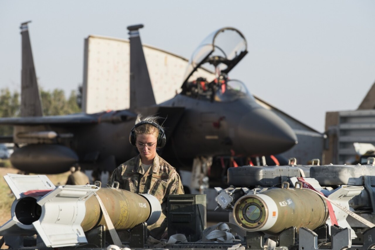 Air Force Senior Airman Amanda Butch, 332nd Expeditionary Maintenance Squadron line delivery technician, accounts for munition that was loaded on a trailer in Southwest Asia