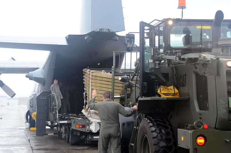 Loadmasters and aerial porters from the 94th Airlift Wing work together to load cargo into the back of a C-130H3 Hercules at Dobbins Air Reserve Base, Ga. Sept. 12, 2017. The more than 16,000 pounds of cargo delivered to Homestead included ready-to-eat meals and infrastructure equipment. Civil engineer and public affairs personnel from Dobbins also stayed behind as part of the relief operation. (U.S. Air Force photo/Don Peek)