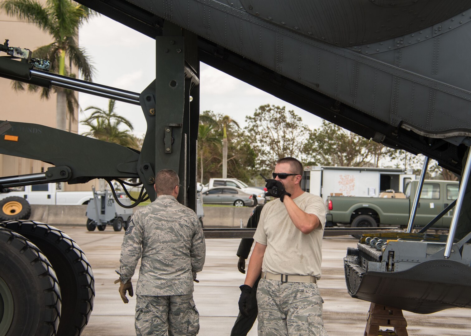 An Airman talks on the radio as a forklift begins offloading cargo from a C-130H3 Hercules at Homestead Air Reserve Base, Fla. Sept. 12, 2017. 94th Airlift Wing C-130s and aircrews provided airlift support Sept. 12, 2017 as part of the Air Force Reserve’s relief efforts following Hurricane Irma. (U.S. Air Force photo/Staff Sgt. Andrew Park)