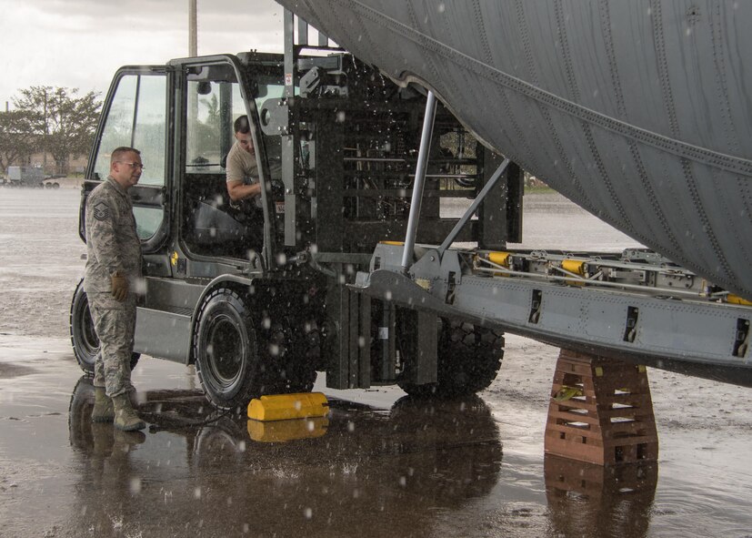 Aerial porters offloads cargo from a C-130H3 Hercules at Homestead Air Reserve Base, Fla. Sept. 12, 2017. 94th Airlift Wing C-130s and aircrews provided airlift support as part of the Air Force Reserve’s relief efforts following Hurricane Irma. (U.S. Air Force photo/Staff Sgt. Andrew Park)