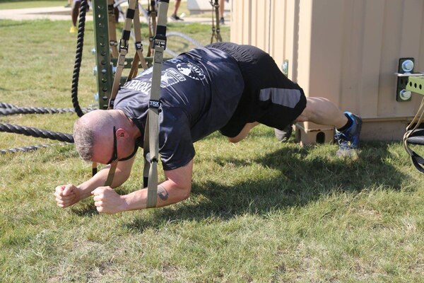 CSM Troxell demonstrates his own planking style while participating in the PT with the rest of the Soldiers.