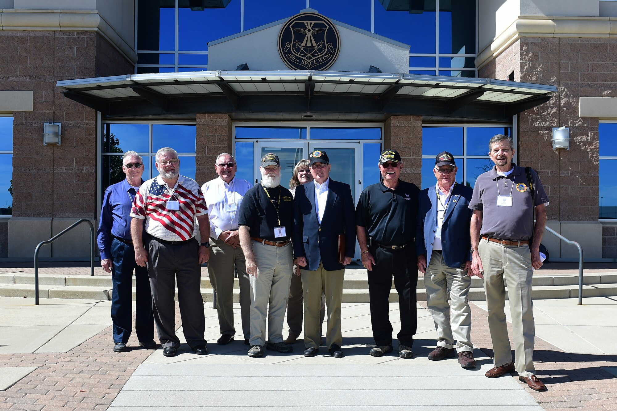 Members of the Tan Son Nhut Association stand together Sept. 14, 2017, in front of the 460th Headquarters building on Buckley Air Force Base, Colo.