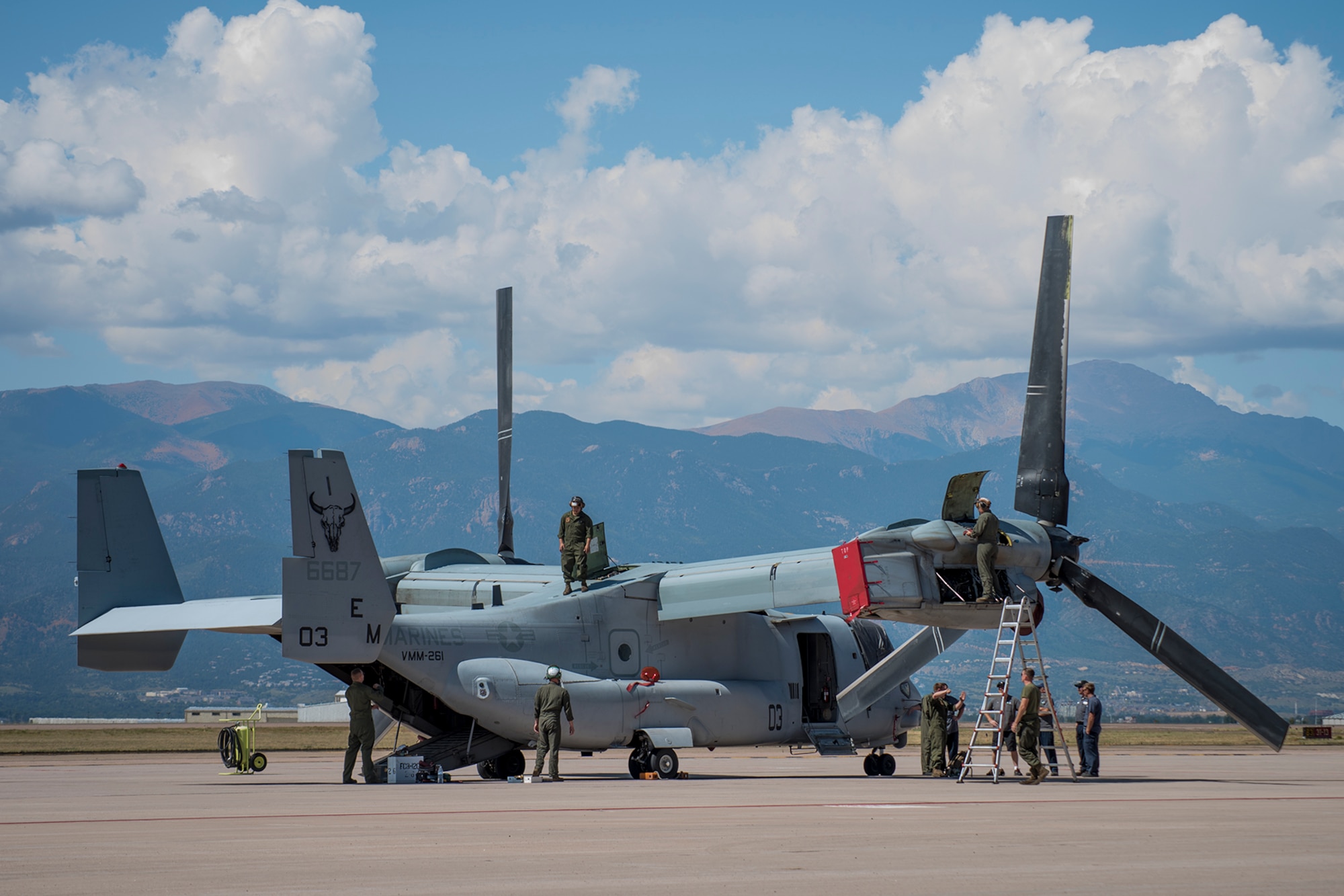 U.S. Marine Corps maintainers assigned to Marine Medium Tiltrotor Squadron 261 (VMM-261) prepare a MV-22 Osprey for high altitude, low visibility landing training at Peterson Air Force Base, Colo., Sept. 12, 2017. Peterson AFB offers a unique combination of altitude and dry climates that are similar to the climate the Marines might encounter while deployed overseas. (U.S. Air Force Photo by Dennis Hoffman)
