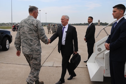 Secretary of Defense Jim Mattis (center) is greeted by U.S. Air Force Gen. John. E. Hyten, commander of U.S. Strategic Command (USSTRATCOM), upon his arrival at Offutt Air Force Base, Neb., Sept. 13, 2017.