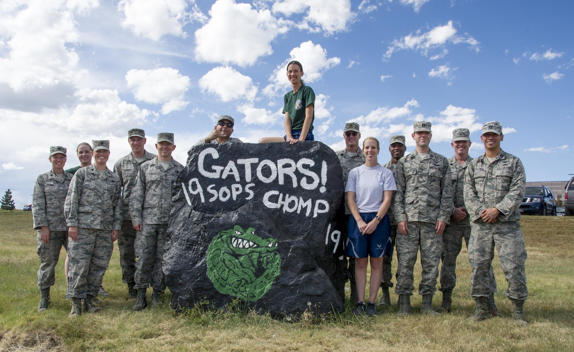 Reserve Citizen Airmen from the 19th Space Operations Squadron pose with the newly painted Spirit Rock on Thursday, Sep. 14, 2017.
