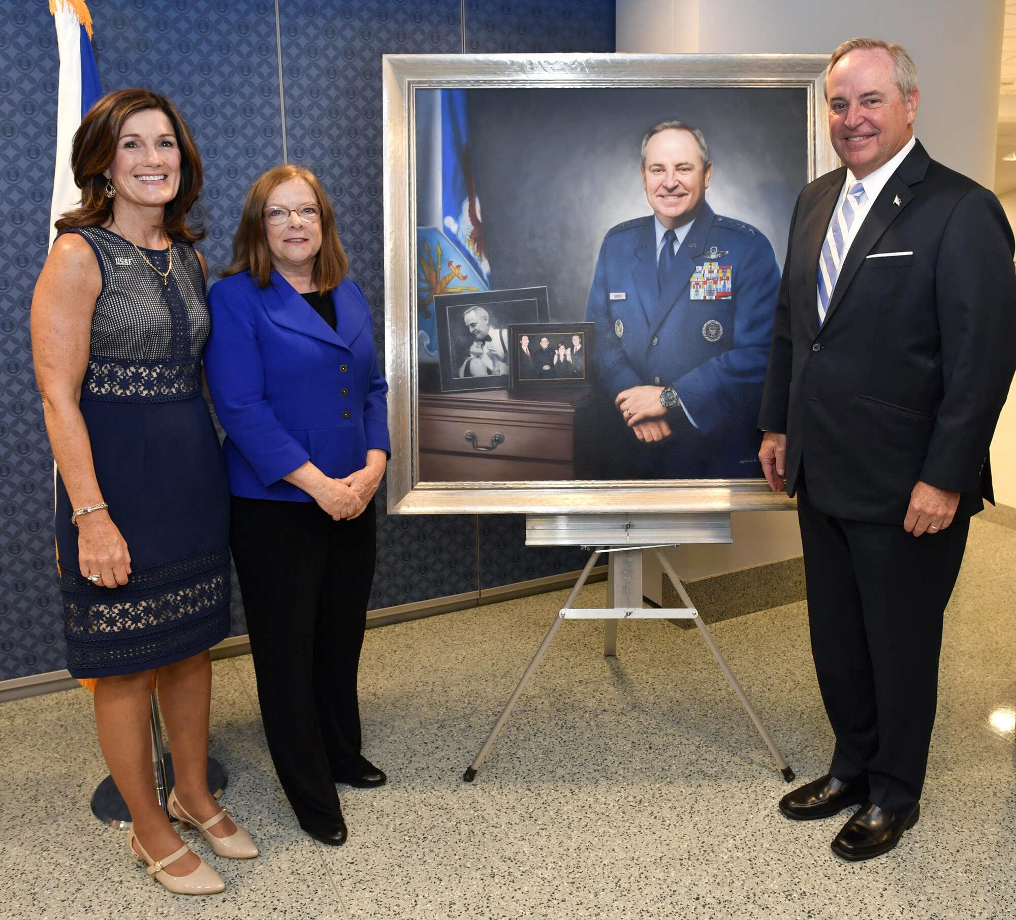 Retired Gen. Mark A. Welsh III, former chief of staff of the Air Force, and Betty Welsh pose with artist Michele Rushworth before the portrait unveiling ceremony in the Pentagon, Washington, D.C., Sept. 14, 2017. The portrait will be on display in the Pentagon's Arnold Corridor alongside the portraits of all the other former Air Force chiefs of staff. (U.S. Air Force photo by Wayne A. Clark)