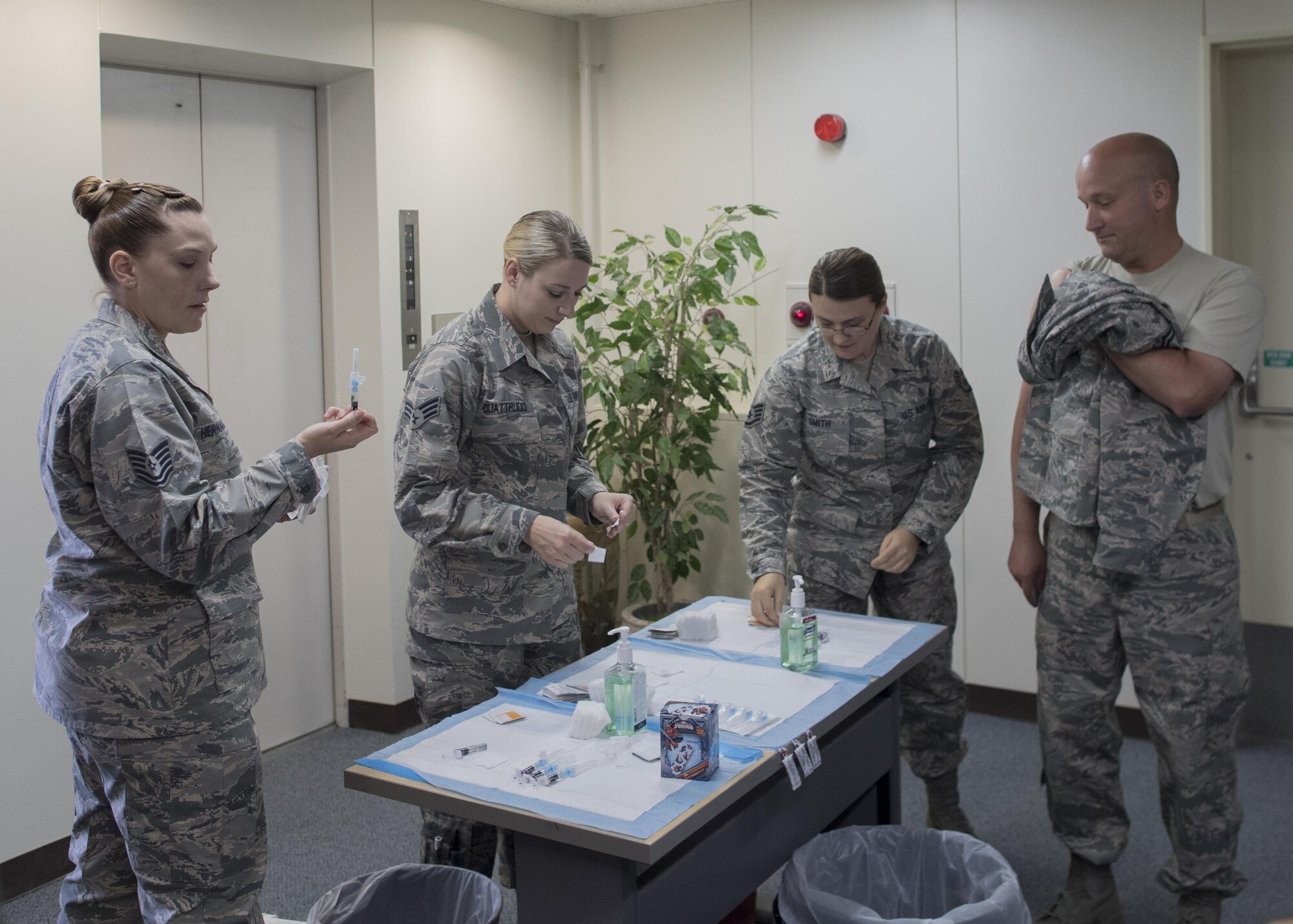 Members of the 374th Medical Group prepare to give base personnel their annual flu shots, Sept. 12, 2017, at Yokota Air Base, Japan.