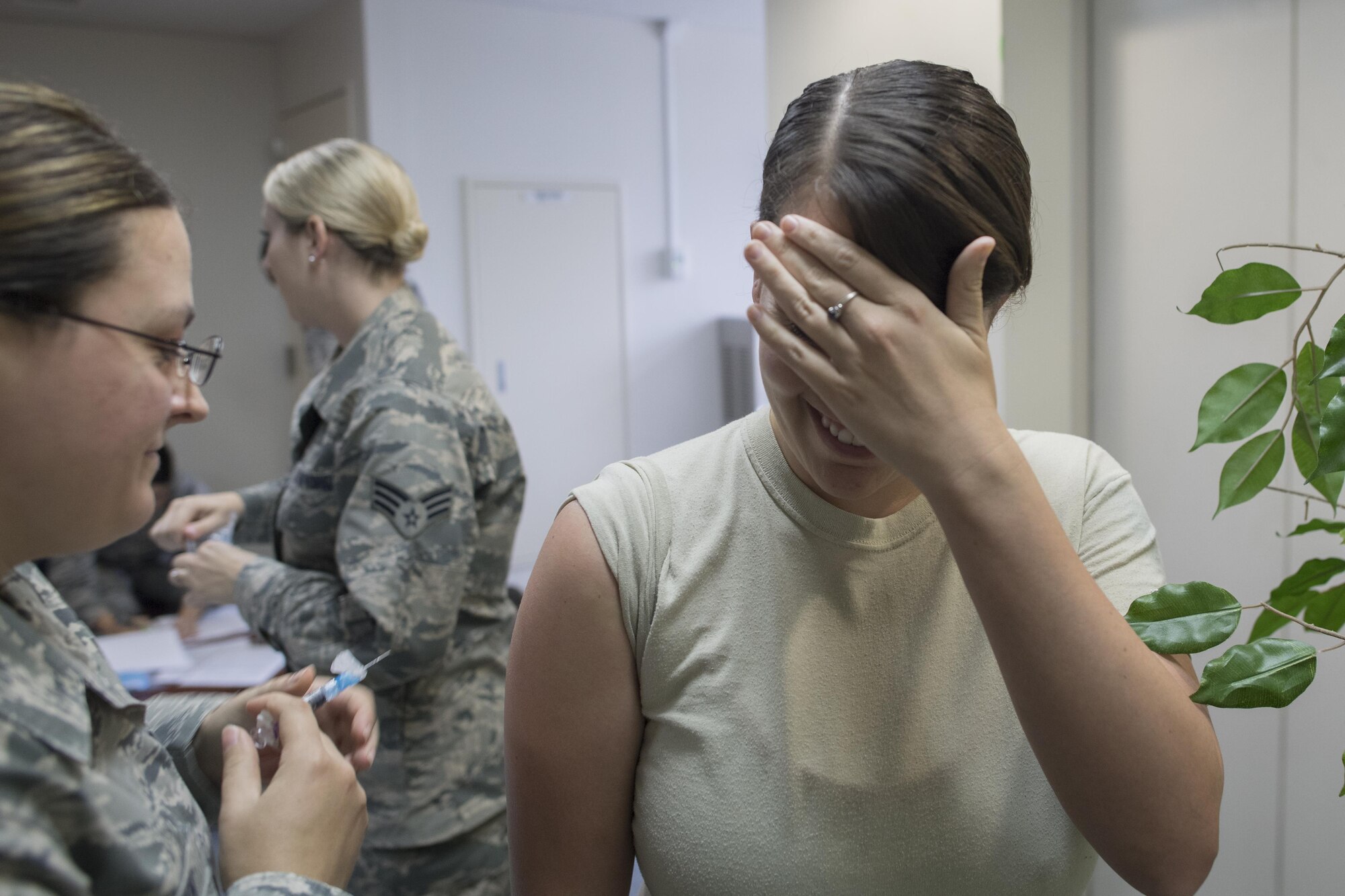 An Airman from the 374th Airlift Wing prepares to receive her annual flu shot, Sept. 12, 2017, at Yokota Air Base, Japan.