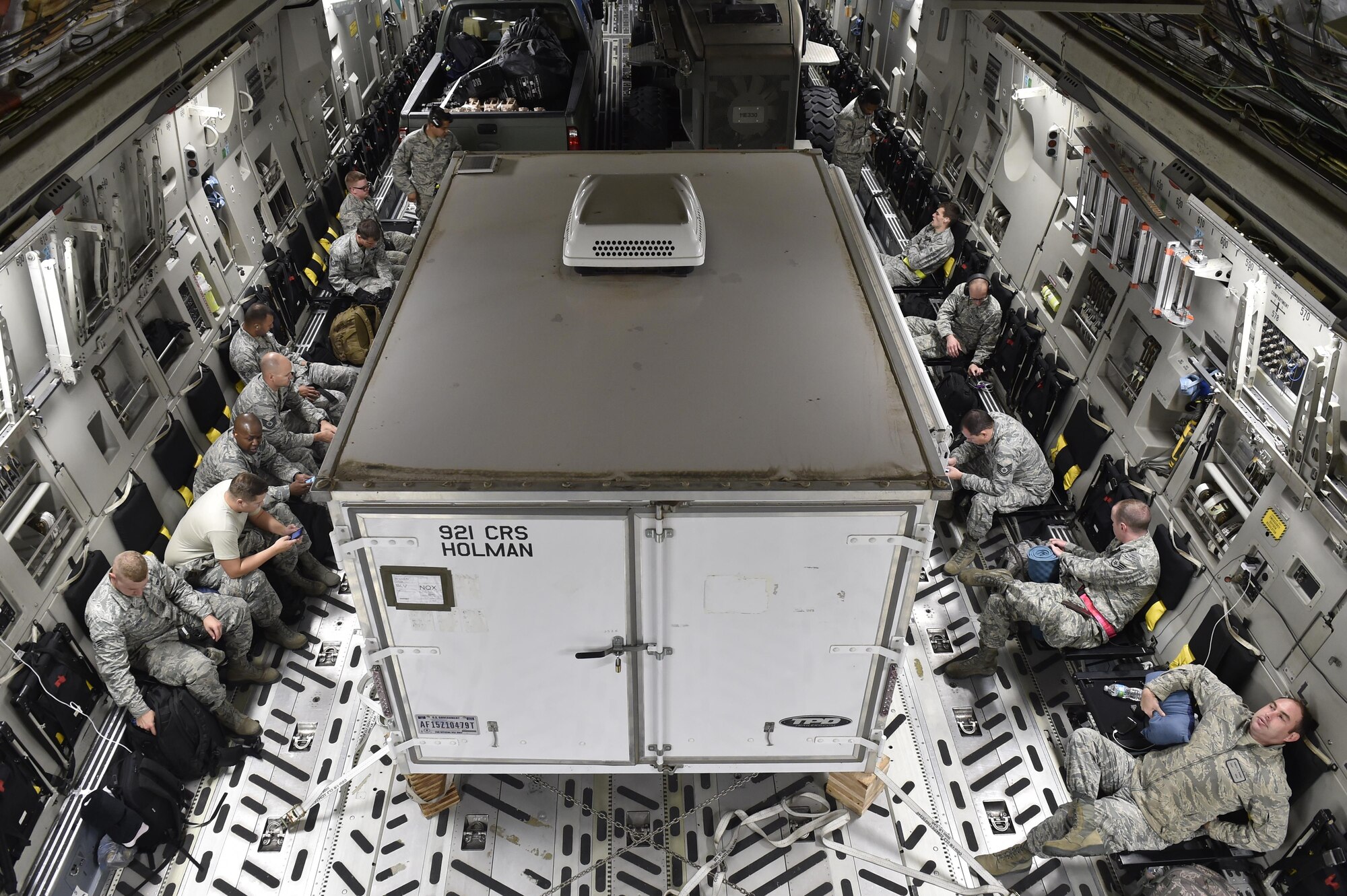 Members from the 821st Contingency Response Group from Travis Air Force Base, Calif., board a C-17 Globemaster III aircraft, Sep. 13, 2017, at Scott Air Force Base, Ill.   The 17-member contingency response team deployed to Homestead Air Reserve Base, Fla., to augment the 439th Airlift Wing airfield capabilities in support of Hurricane Irma relief efforts.  (U.S. Air Force photo by Tech. Sgt. Liliana Moreno/Released)