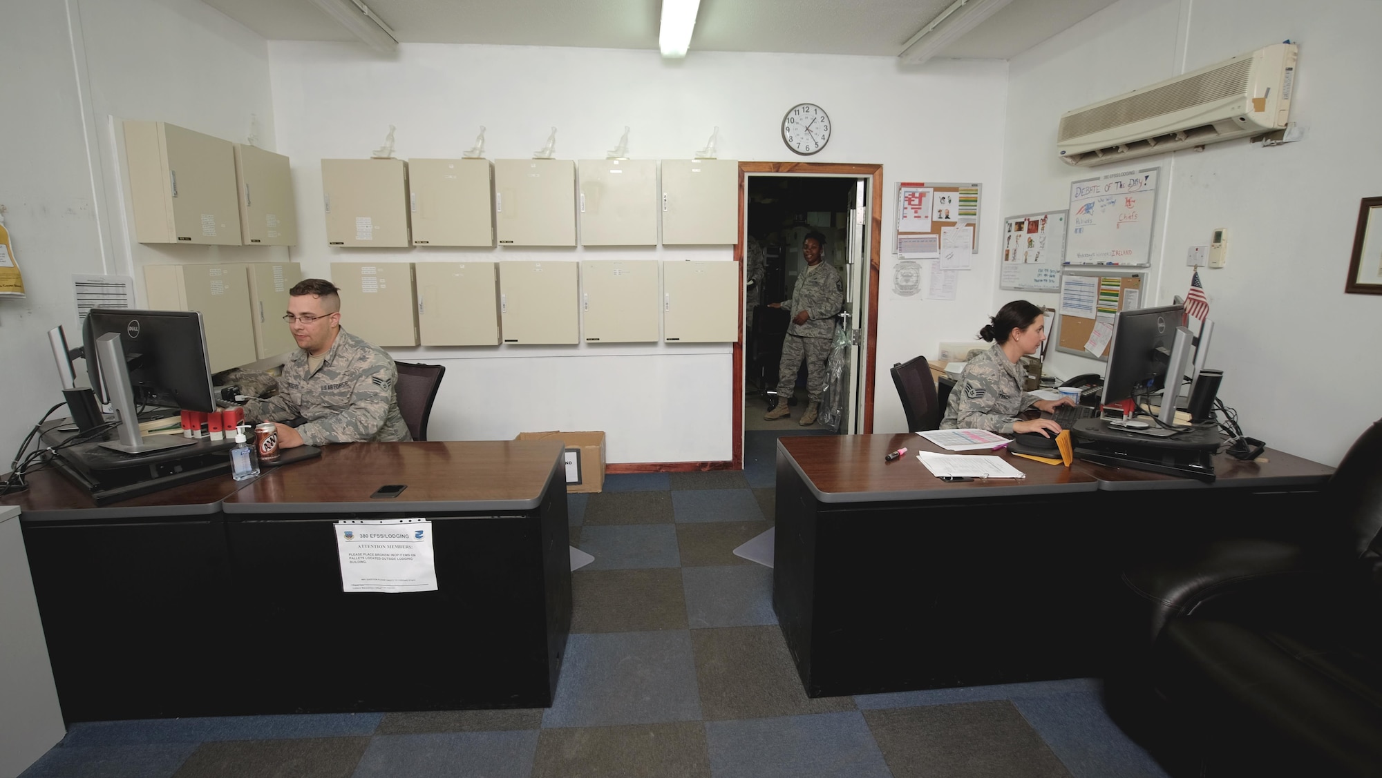 Members of the 380th Expeditionary Force Support Squadron Lodging Office file work orders Sept. 7, 2017, at Al Dhafra Air Base, United Arab Emirates.