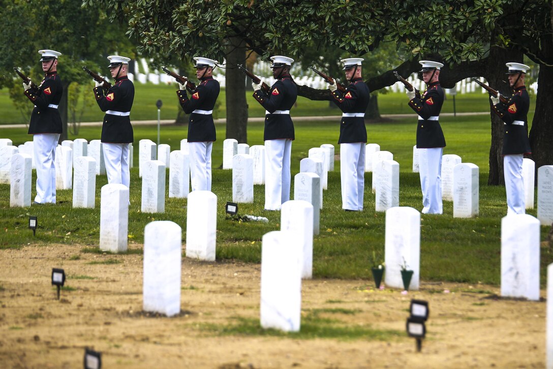 Marines with the Bravo Company firing party, Marine Barracks Washington D.C., render a three-volley salute during a full honors funeral at Arlington National Cemetery, Va., Sept. 13, 2017. Marine Barracks Washington is home to the Marines who provide support for all Marine Corps funerals and many high-ranking government officials funerals within the Capitol area. (Official U.S. Marine Corps photo by Lance Cpl. Damon Mclean/Released)