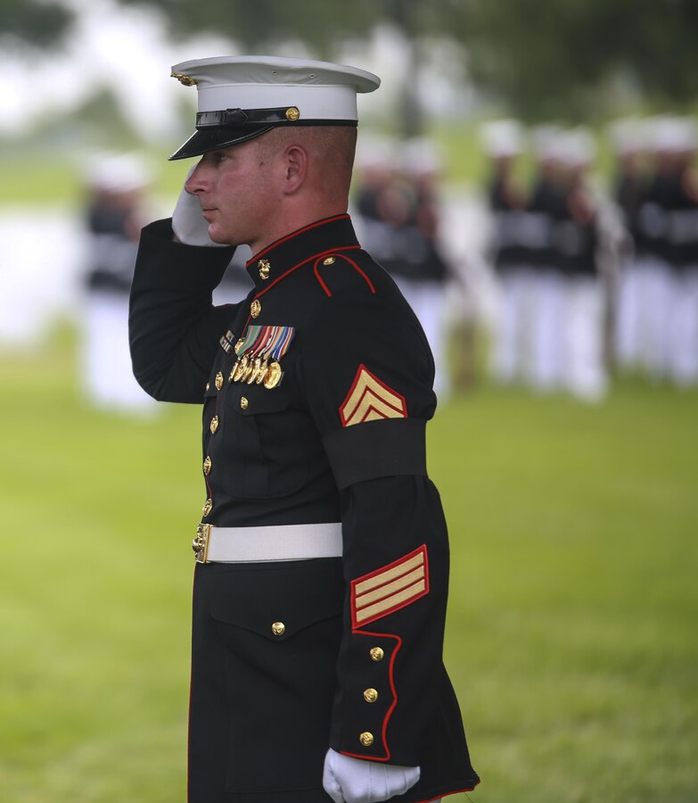 Gunnery Sergeant Nicholas Brundige, assistant funeral director, Marine Barracks Washington D.C., salutes the National Flag during a full honors funeral at Arlington National Cemetery, Va., Sept. 13, 2017. Marine Barracks Washington is home to the Marines who provide support for all Marine Corps funerals and many high-ranking government officials funerals within the Capitol area. (Official U.S. Marine Corps photo by Lance Cpl. Damon Mclean/Released)