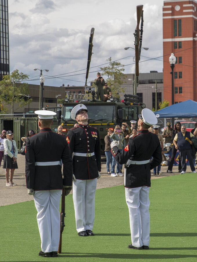 Corporal Jarris Wade, rifle inspector, U.S. Marine Corps Silent Drill Platoon, and Lance Cpl. Daniel Linebaugh, rifle inspection team, SDP, execute precision rifle drill movements during a performance at the static display section of Marine Week, Detroit, MI. Sept. 7, 2017. Marine Week, hosted by the Marine Corps in one city per year, is a celebration of community, country and Corps that allows the public to connect with Marines through live-demonstrations, hands-on static displays and several other interactive events. (Official U.S. Marine Corps photo by Cpl. Robert Knapp/Released)